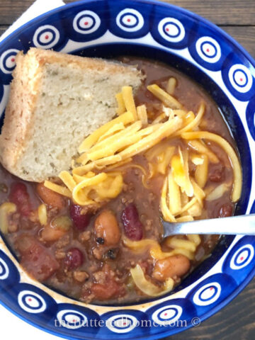 Instant Pot Chili in a blue and white bowl with bread