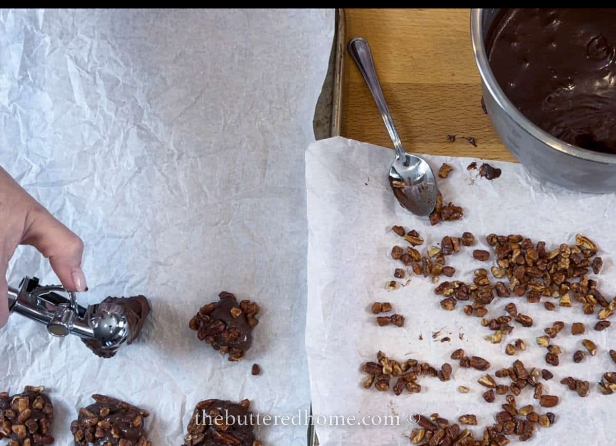 setting scooped truffle balls on parchment paper