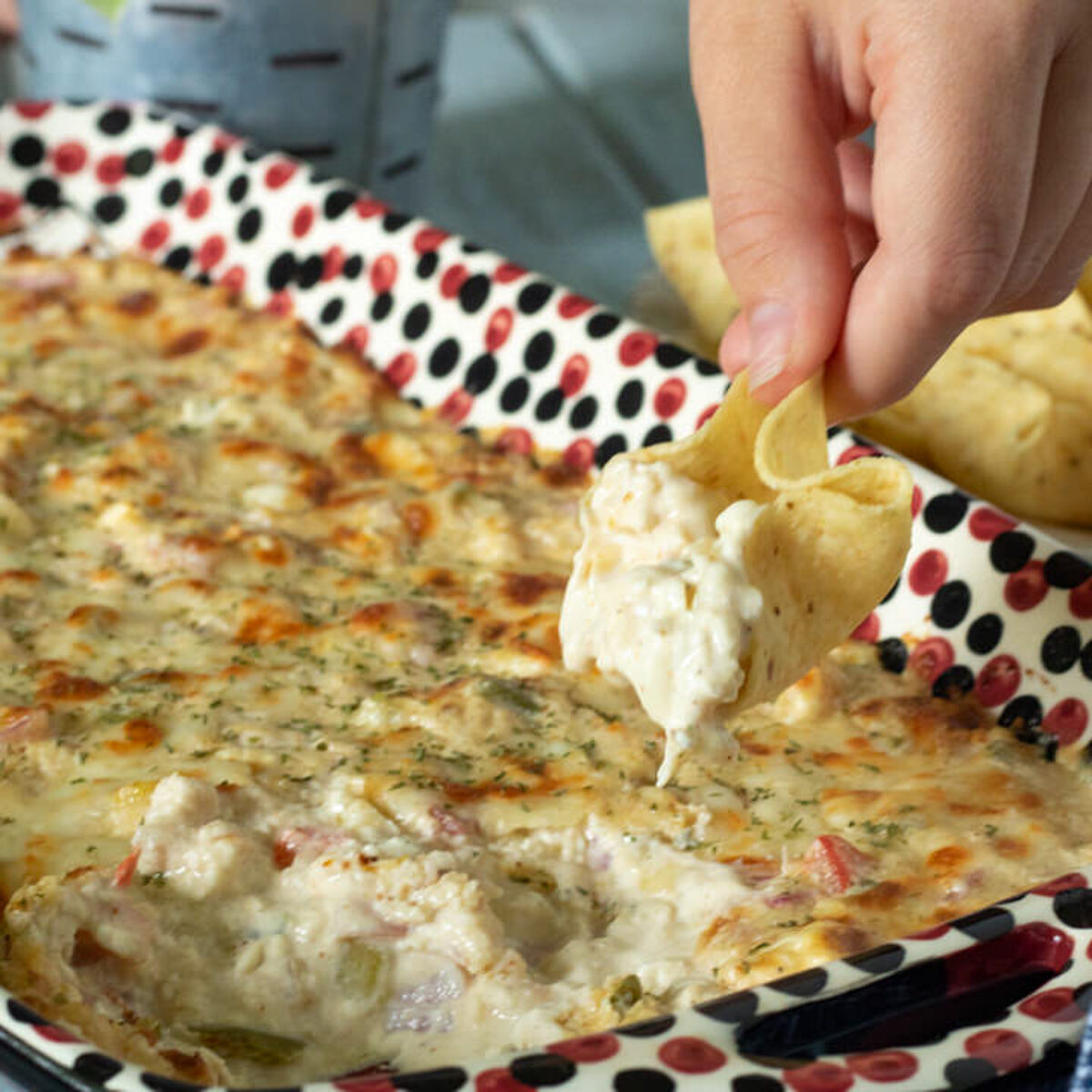 a scoop with a bite of shrimp dip