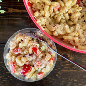 close up of macaroni salad on a dark wood table