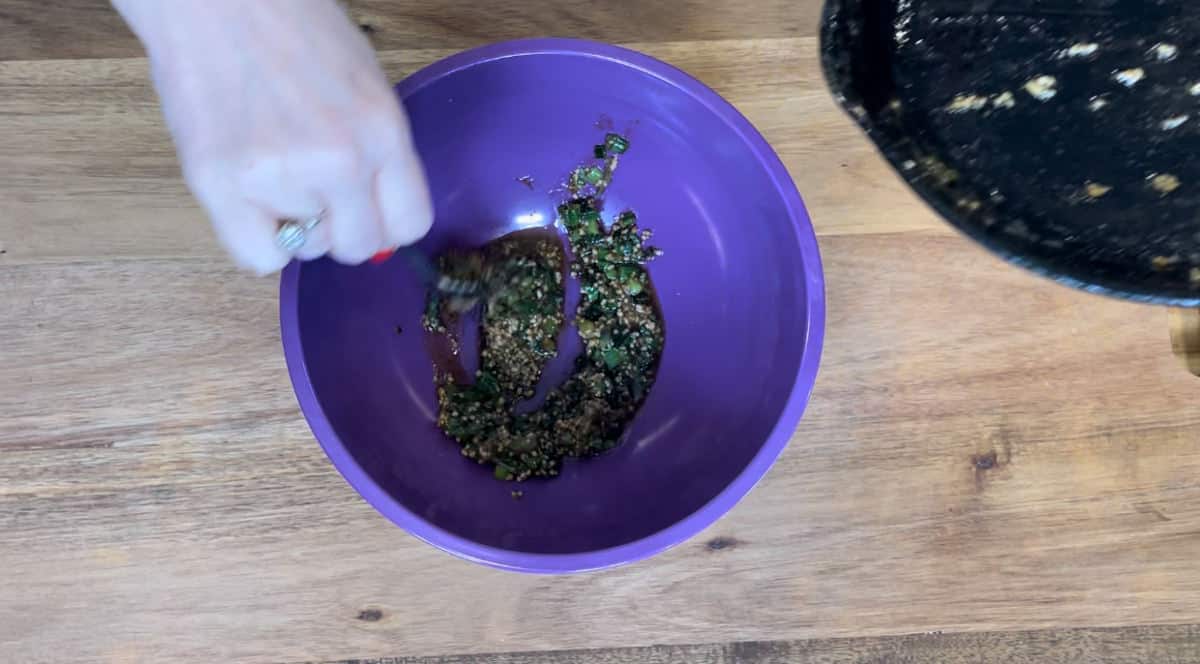 putting butter and onion mixture into a mixing bowl.