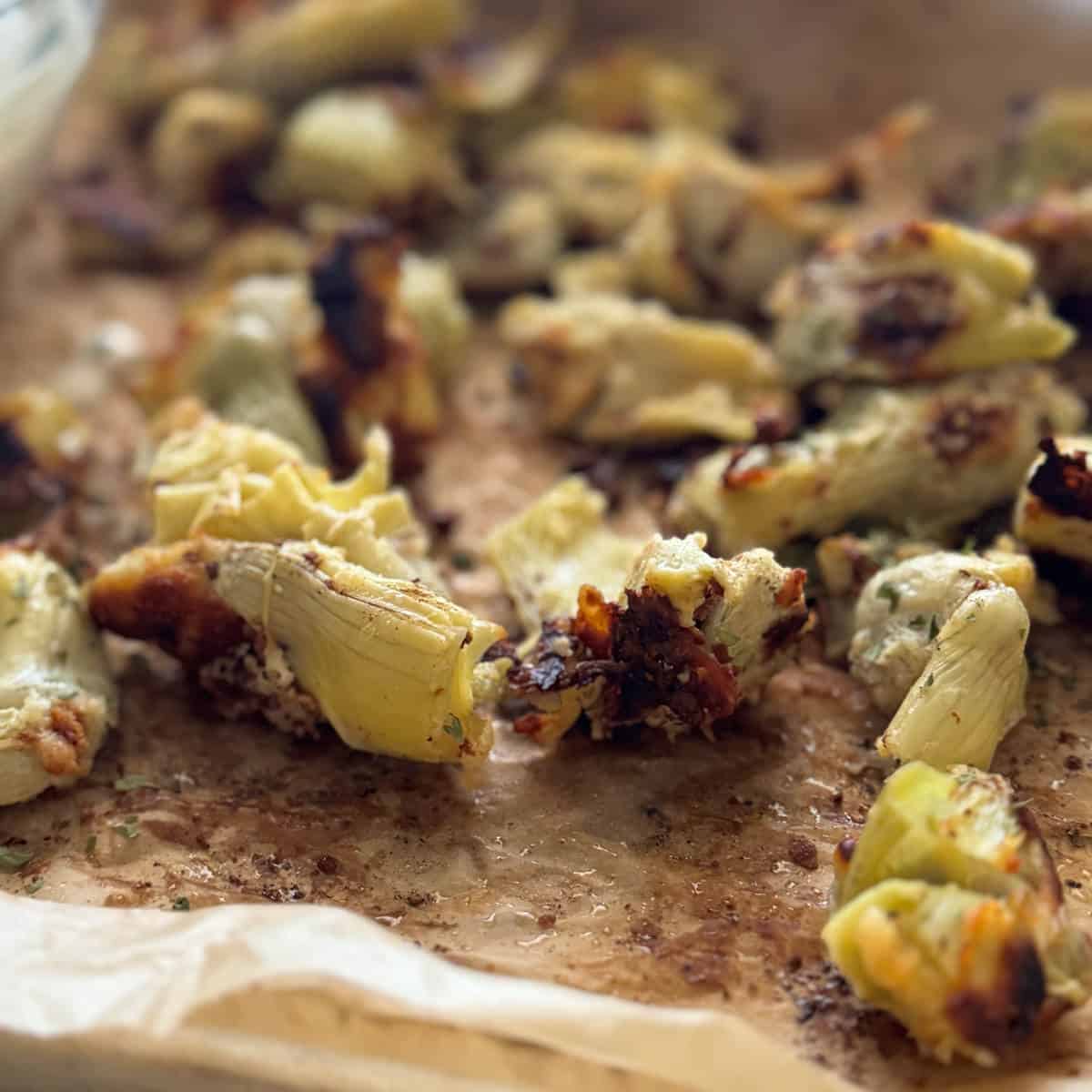 Perfectly crisp artichoke hearts on brown parchment.