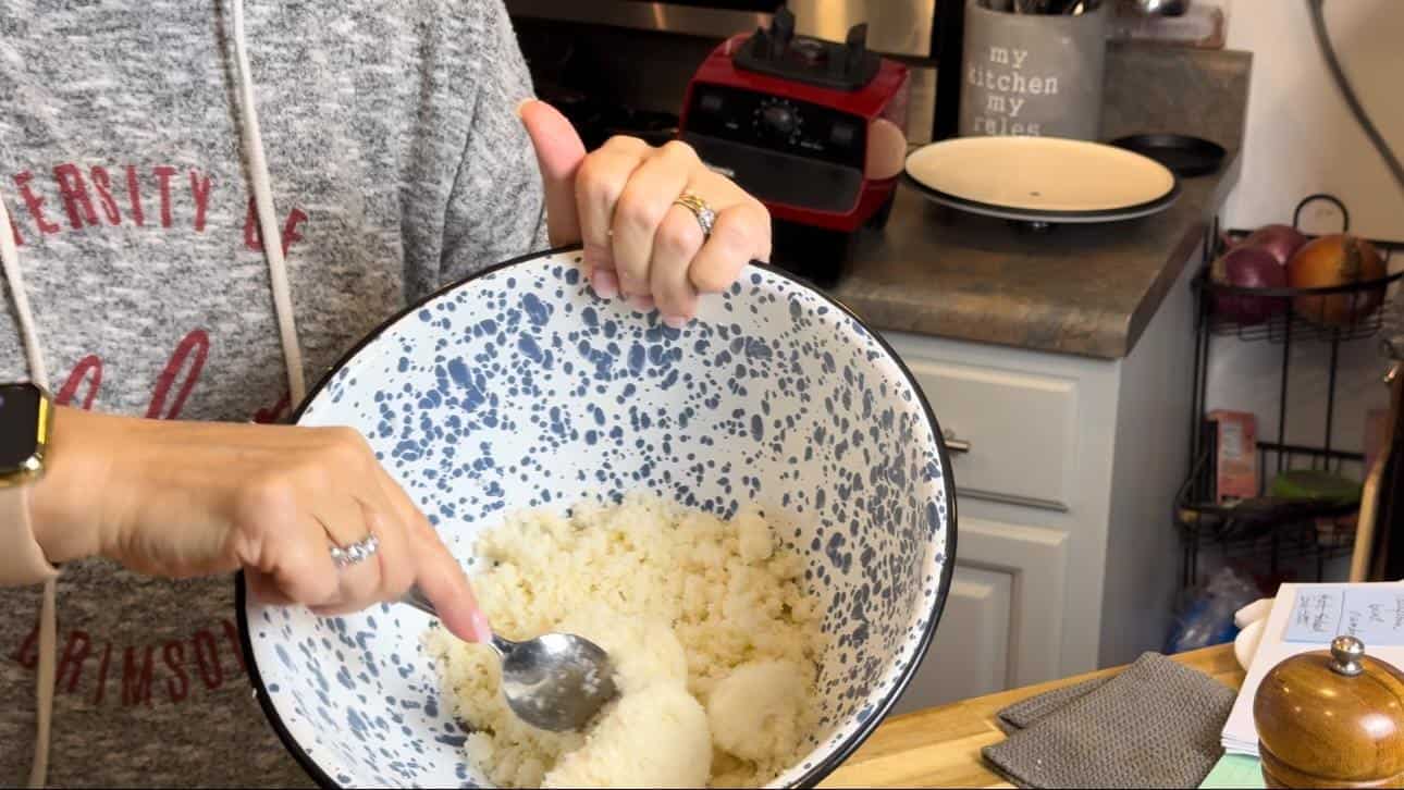 cauliflower in a ble and white bowl.