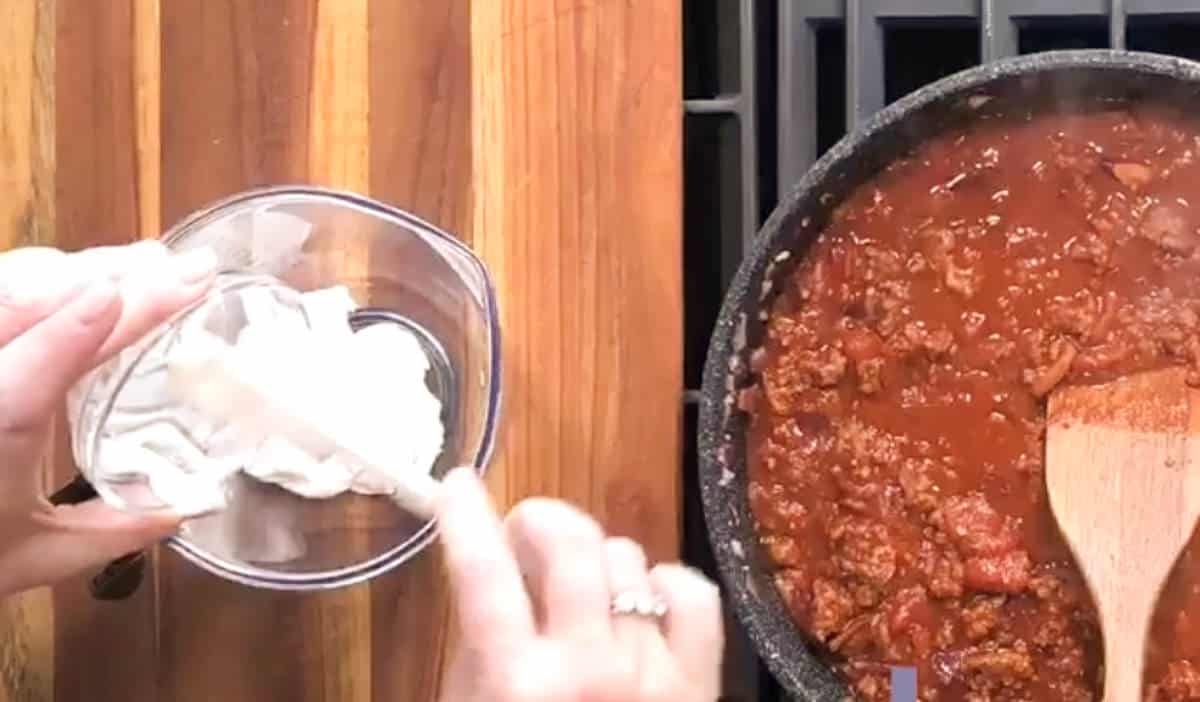 Adding sour cream.
