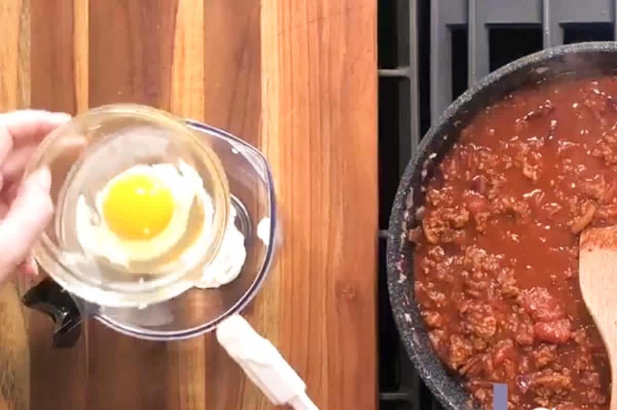 Adding one egg.
