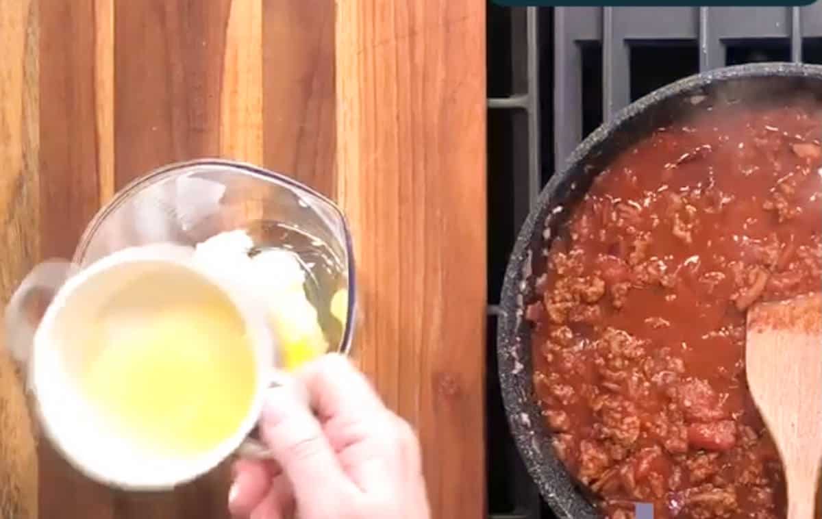 Adding cooled but melted butter.