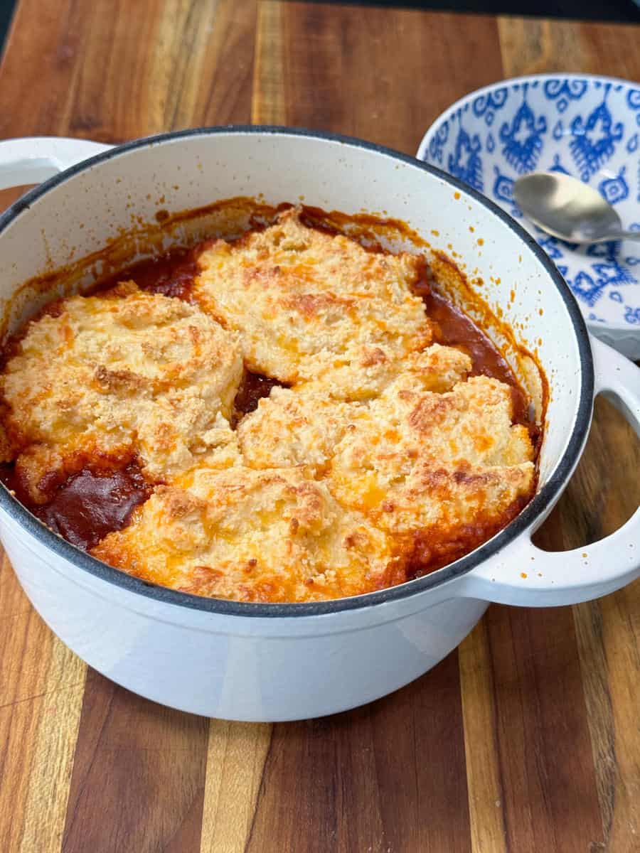 Chili pot pie in a white dutch oven.