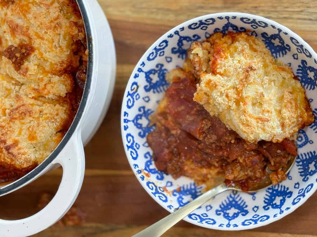Close up picture of keto chili pot pie with full pot nearby.