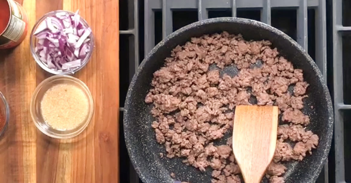 Browned and drained lean ground beef added back to the skillet.