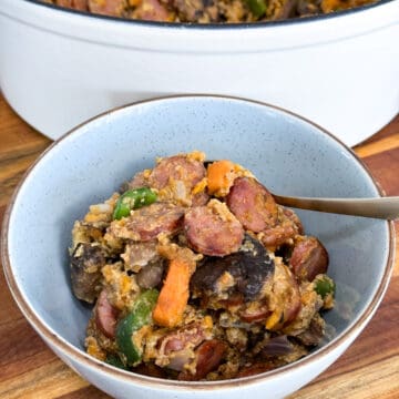 Large serving of chicken andouille hash in a blue bowl.
