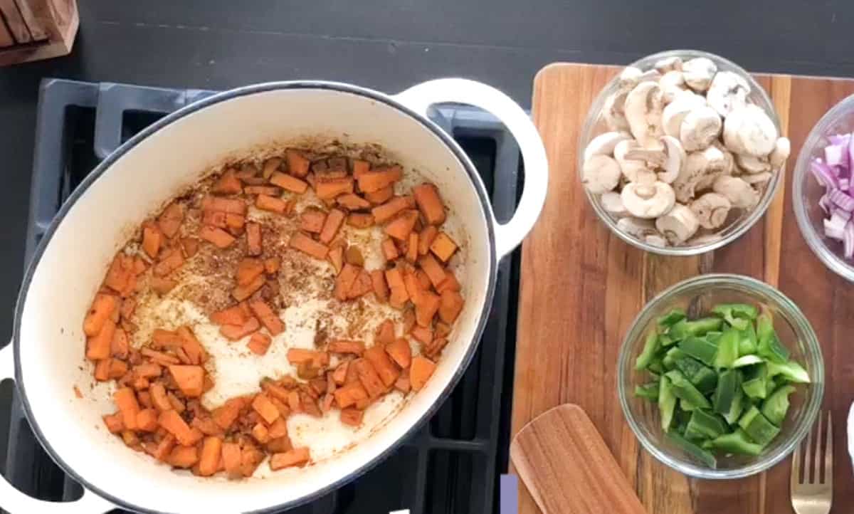 Cooked and cubed sweet potatoes along with other ingredients in clear dishes.
