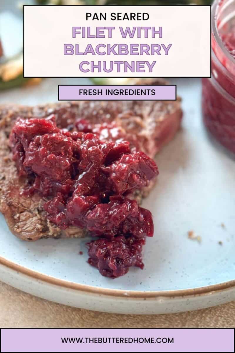 A close-up of pan-seared filet topped with blackberry chutney sits on a white plate with a light blue rim. In the background is a jar filled with the same chutney. The text above reads "Pan Seared Filet with Blackberry Chutney" and "Fresh Ingredients.
