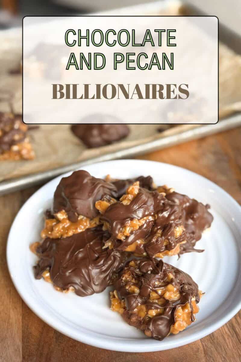 A white plate holds chocolate and pecan confections, covered in melted chocolate. In the background, more confections are on a baking tray. Text overlay reads, "Chocolate and Pecan Billionaires.