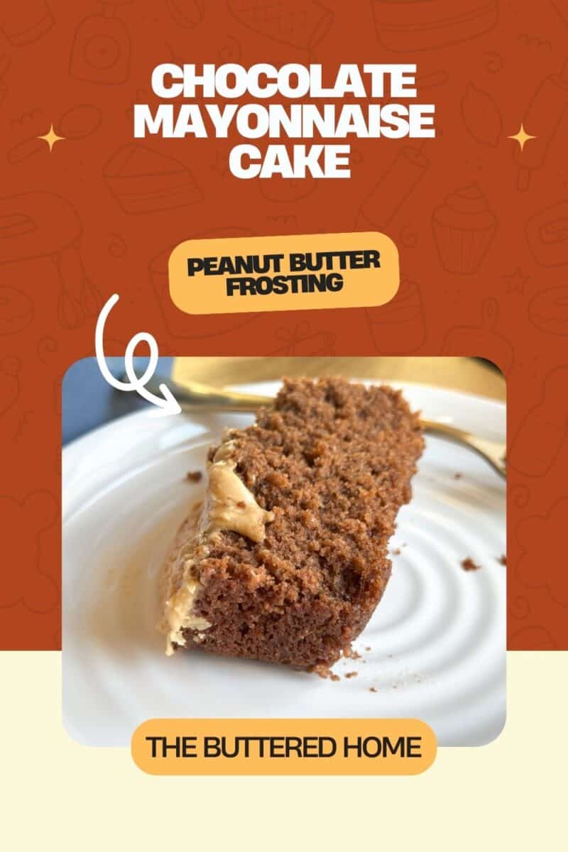 A slice of chocolate mayonnaise cake with peanut butter frosting is on a white plate. A fork lies next to the cake. Text on the image reads, "Chocolate Mayonnaise Cake," "Peanut Butter Frosting," and "The Buttered Home." The background shows baked goods.