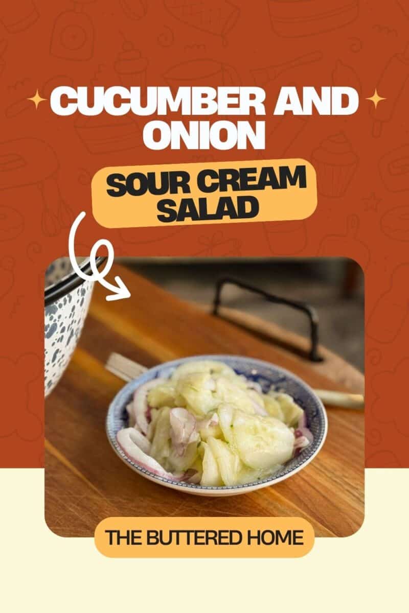 A small dish containing a cucumber and onion salad with sour cream is placed on a wooden surface. The background is a patterned red with text describing the dish. A larger patterned bowl is partially visible to the side.