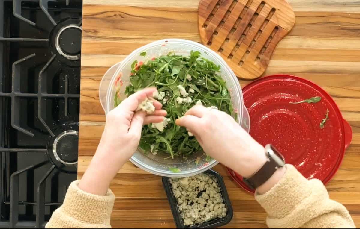 Dressing Warm Butternut Squash and Arugula Salad with gorgonzola.